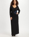 An asymmetrical ruched triangle waist detail gives this style a flattering form. V-neck Long sleeves with ruched cuffs Pull-on style Maxi dress with seamed detail About 61 from shoulder to hem 72% viscose/28% polyester Machine wash Imported 
