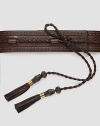 Hand-stained leather styled with tassels, studs and bamboo detail with antique gold hardware. About 2½ wide Made in Italy 