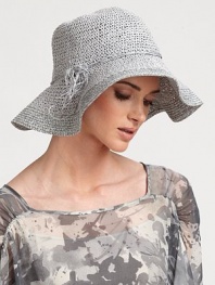 Softly textured raffia cloche, with raffia tie trim at brim, retains shape after packing.RaffiaTie detailBrim, about 4Spot cleanMade in Italy