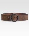 Distressed leather and a circular iron-finished buckle create a rustic design that can be worn at the waist or hips.Iron-finished buckleAbout 2½ wideImported