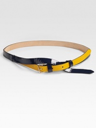A graphic, colorblocked style with a cross-over design and a brass buckle. Width, about ½Made in Italy