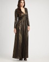 Shimmering, floor-length v-neck with a ruched silhouette and flattering empire waist. Gathered v-neckRuched empire waistLong sleevesInvisible back zipperAbout 65 from shoulder to hemFully lined92% polyester/8% spandexDry cleanMade in USA of imported fabric