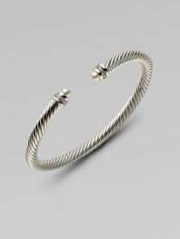 A signature Yurman cable of sterling silver, richly enhanced by bands of pavé diamonds encircling lustrous white freshwater pearl end caps. Diamonds, 0.09 tcw White freshwater pearls Sterling silver Cable, 5mm Diameter, about 2¼ Made in USA