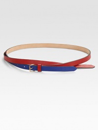A graphic, colorblocked style with a cross-over design and a brass buckle. Width, about ½Made in Italy
