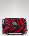 Red zebra haircalf puts an exotic spin on this sophisticated shoulder bag from Badgley Mischka.