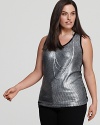 This shimmering Karen Kane tank becomes your glamour go to for a fashion-forward season.