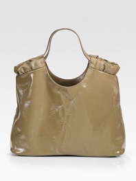 A slouchy carryall for your must-have items in patent leather, complete with iconic signature stitching. Double top handles, 8½ dropOne inside open pocketCotton lining17W X 10½H X 5DMade in Italy