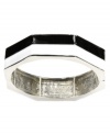 Earn your stripes with this trendy style. Nine West's chic colorblock bangle is perfect for stacking with its black and white enamel design and silver tone mixed metal setting. Bracelet stretches to fit wrist. Approximate diameter: 2-1/2 inches.