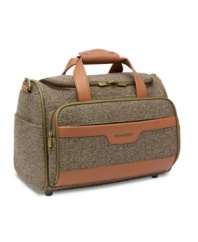 Lend your travels a look of distinction with Hartmann's handsome cosmetic tote. Outfitted in sophisticated tweed with rich, leather accents, you'll be able to organize your belongings for journeys both short and long. Lifetime warranty.