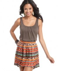 Get the look of two pieces in this one super stylish dress by Living Doll, featuring a solid, tank-style bodice and a tribal-printed skirt with a trendy high-low hem.