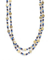 Wear it long, or layer it up for an ultra-trendy look. Lauren by Ralph Lauren's stylish expedition necklace features small wood and glass beads combined with polished metallic discs. Set in worn gold tone mixed metal. Approximate length: 60 inches.