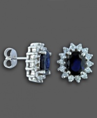 Capture an audience with royalty-inspired earrings featuring oval-cut sapphire (2-7/8 ct. t.w.) and round-cut diamond (3/4 ct. t.w.) set in 14k white gold, from Effy Collection. Approximate diameter: 1/2 inch.