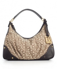 Calvin Klein wraps the popular hobo silhouette in a modern logo jacquard for a stylish everyday purse.
