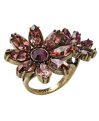 Chic and colorful. Sparkling crystals in vibrant shades of pink and purple stand out on Fossil's unique double-daisy silhouette ring. Made in gold tone mixed metal, it has an eye-catching effect for day or evening. Size 7.