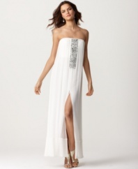 BCBGMAXAZRIA elevates the bohemian silhouette of this silk dress with the addition of a sparkling jeweled front placket and a sexy thigh-high slit at the front of the skirt.