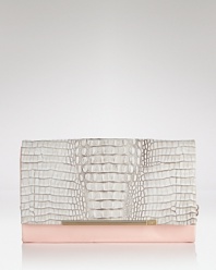 DIANE von FURSTENBERG's patent and embossed leather clutch is a cool girl's party plus one. Textured leather is on trend, while the shape is utterly revel-ready.