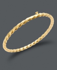 Polished design for the tiny fashionista. This chic bangle for children features a smooth, twisted design in 14k gold. Approximate diameter: 2 inches.
