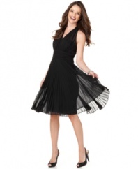 You're sure to look red-carpet ready in this petite pleated halter dress by Evan Picone. The silhouette says Hollywood and begs to be taken for a twirl on the dance floor.