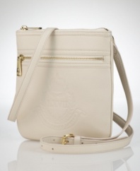 Rich, pebbled leather is handcrafted into a compact shape with an embossed signature crest, adding an authentic heritage touch to this Lauren by Ralph Lauren crossbody design.