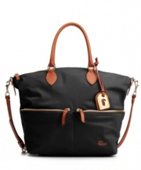 Dooney & Bourke creates the Vanessa bag in sleek colorful nylon with rich leather trim and convertible straps.