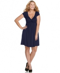 Ruching and gathering lend an ultra-flattering silhouette to the short sleeve plus size dress by Soprano-- it's a must-have!