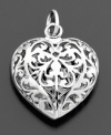 Romantic and lovely, this filigree heart charm is crafted in sterling silver. By Rembrandt Charms. Approximate drop: 3/4 inches.