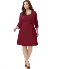 A slimming faux wrap silhouette beautifully defines NY Collection's three-quarter sleeve plus size dress-- be the beauty of the boardroom! (Clearance)