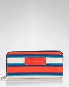 Practical accessories have a place in every it-girl's purse. But in vivid stripes, this croc-embossed rubber from MARC BY MARC JACOBS is almost too chic to keep inside.
