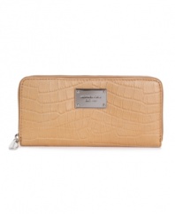 Available in rich colors or classic python, this MICHAEL by Michael Kors leather wallet keeps your essentials on hand.