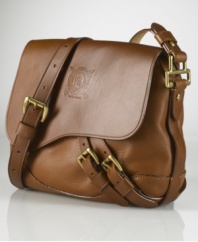 This heritage-inspired leather bag features a diagonal double-strap detail across a stylish, compact silhouette.