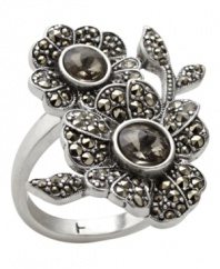 Very Victorian. With sparkling marcasite accents and a distinctive double flower silhouette, this exquisite ring from Fossil draws inspiration from a past era. Crafted in vintage silver tone mixed metal. Size 7.