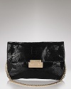 Add a bit of night magic to your look with Michael Michael Kor's glamorous patent python clutch.
