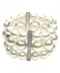 Adorn your wrists with three rows of shimmer. Givenchy's glass pearl bracelet makes for a perfect special occasion accent. Features silver tone mixed metal and crystal bar accents. Bracelet stretches to fit wrist. Approximate diameter: 2-1/8 inches.