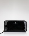 kate spade new york's patent leather wallet is a slick purse companion. This practical accessory slips inside a structured tote to keep the urban essentials at an arm's length.