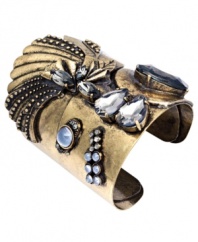 Give your look a little cuff love. Bar III's head-turning cuff bracelet features an intricate design accented by clear and blue acrylic stones in a variety of shapes and sizes. Crafted in burnished gold tone mixed metal. Approximate diameter: 2-1/3 inches.