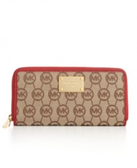 MICHAEL Michael Kors' classic monogram continental gets a fun energy with vibrant contrast leather trim in a variety of hot hues, while the 18K gold logo plaque adds luxe appeal.