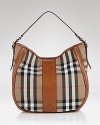 Iconic as it is eye-catching, Burberry's signature check hobo is a stylishly sound investment. The classic carryall elevates daily looks, calling for a trench coat and polished pumps.