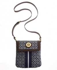 Keep it classic with this tasteful crossbody from Tommy Hilfiger. A timeless signature exterior features a preppy stripe at center and iconic goldtone hardware at front.