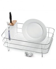 Reclaim your kitchen and keep your dishes spotless. This slim simplehuman dish rack features a slim design that opens up more valuable work space by incorporating a built-in drip tray and spout that empties directly into the sink -- no more ugly, bulky mats to cover up your precious counter space! Five-year warranty.