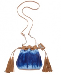 A water color-inspired design with an easy-going appeal. This versatile crossbody style from Carlos Santana features an earthy appeal with shades of blue, tassel detail an adventure-ready silhouette.