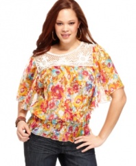 Be a boho beauty with Belle Du Jour's butterfly sleeve plus size top, featuring an on-trend floral print and peplum waist.