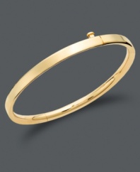 The perfect accessory for your little princess. This smooth bangle features a guard and hinge design in 14k gold. Approximate diameter: 2 inches.