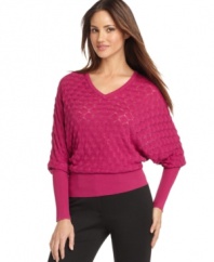 An allover waffle knit adds on-trend texture to this silk-blend Calvin Klein sweater -- perfect for cold-weather style!