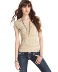 Dolled Up gives a classic sweater a high-end revamp via super-sized cable knit design and rocker-chic shredding!
