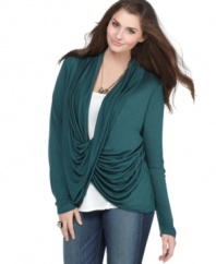 Add a cool twist to your look with Soprano's long sleeve plus size top, featuring a draped front and inset.