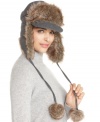 Nine West combines two hot trends - the captain brim and the trooper style - and adds cute pom-poms for a look that's stylish, warm and fun.