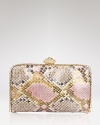 Embrace your exotic instincts with this genuine python clutch from Clara Kasavina. With a Swarovski crystal embellished frame, this ultraluxe bag is the perfect partner for your finest jewels.