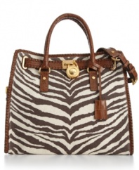 A wildly haute tote from MICHAEL Michael Kors. Eye-catching zebra printed canvas, polished goldtone hardware and intricate whip stitched accents add untamed appeal to this gorgeous bag.