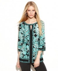Get an effortless exotic look with this petite tunic by INC, featuring a keyhole neckline and transporting print.