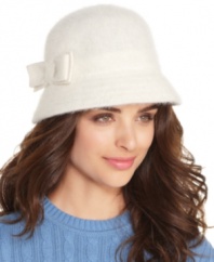 An adorable bow finishes off this fuzzy, face-framing, angora-blend cloche hat by Nine West.
